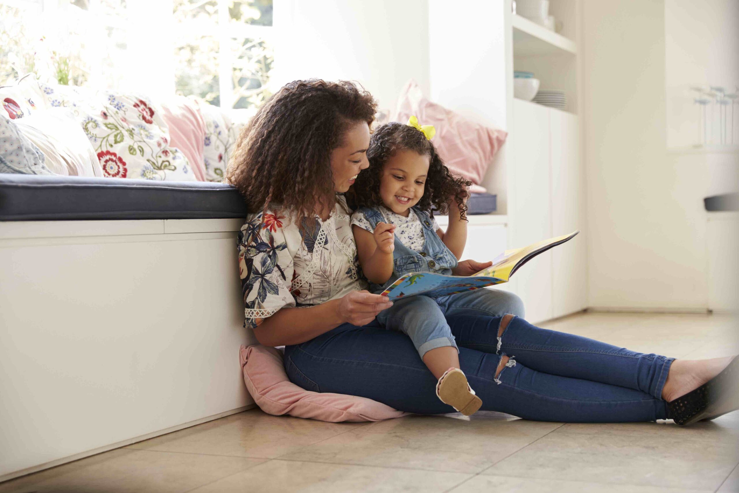 Mom reading to daughter