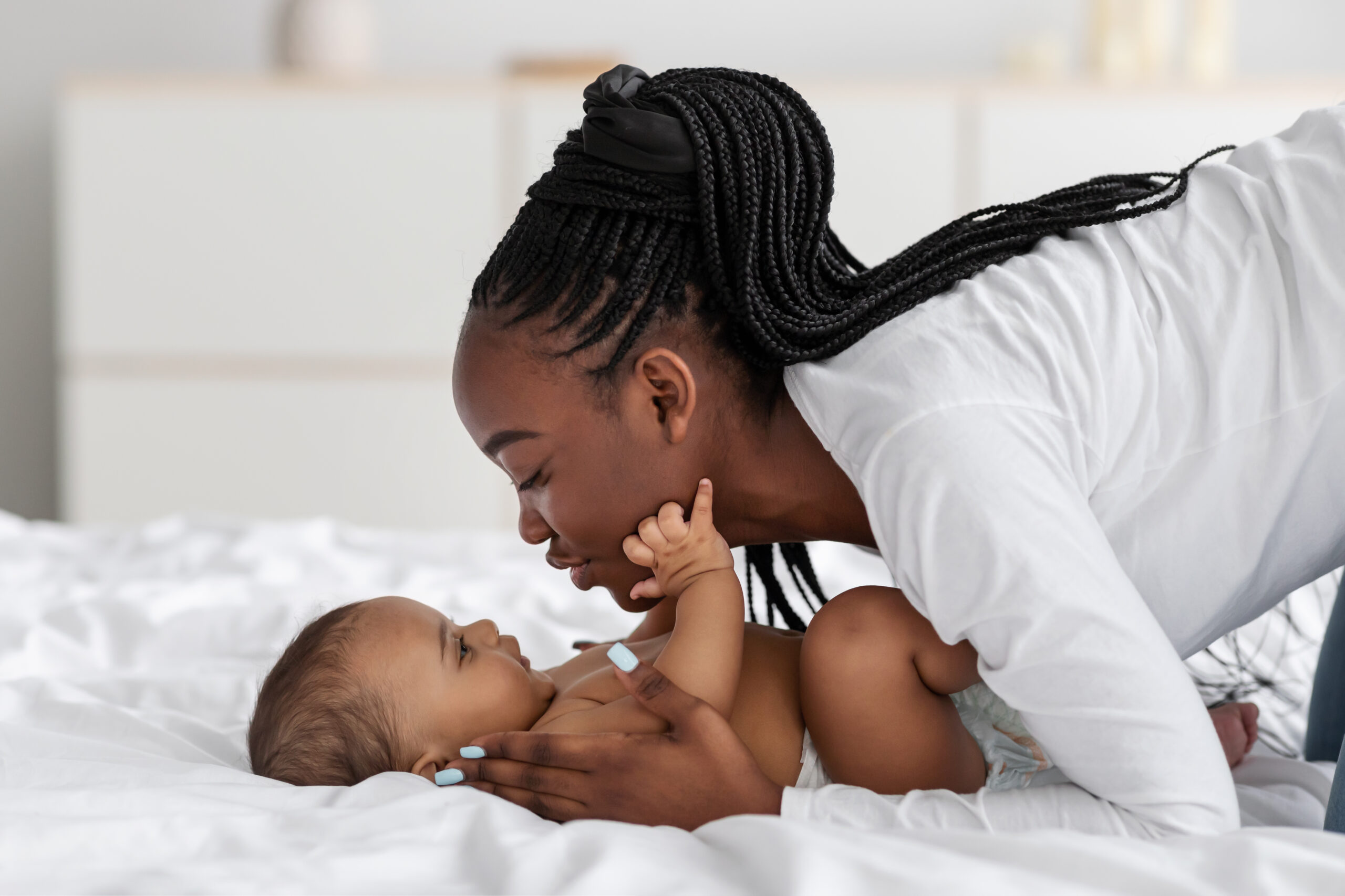 Black mom holding her baby